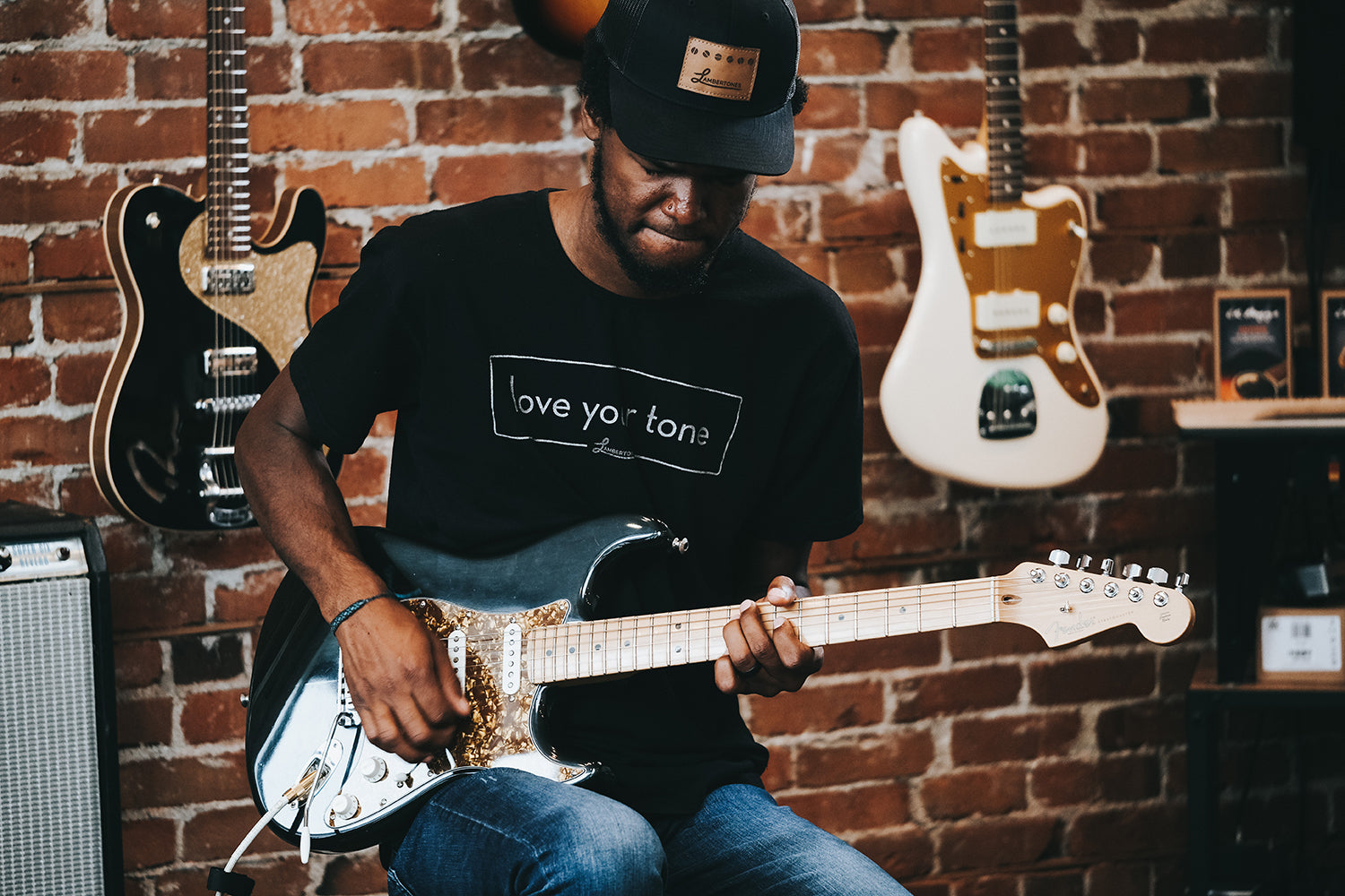 Artist Sami Castillo playing a set of “the Triple Shots” in a custom MIA Fender Stratocaster.